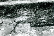 Fragment of the northern wall profile of the trench in the collegiate church and stone walls of the church