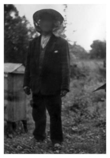 A beekeeper and a wooden beehive